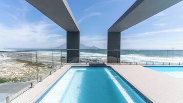 Outdoor pool, open 9:00 AM to 6:00 PM, pool umbrellas, sun loungers