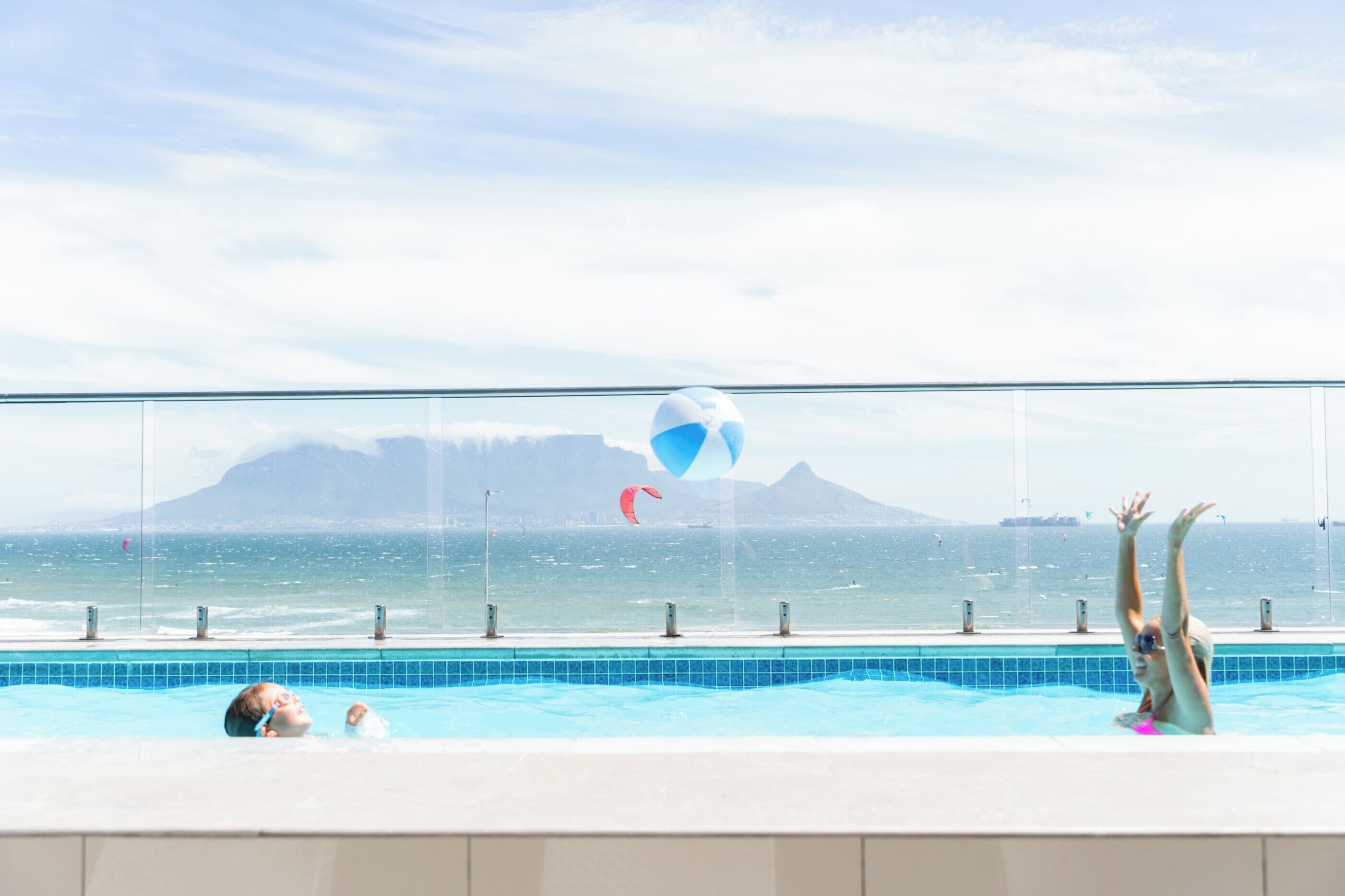 outdoor pool, open 9:00 am to 6:00 pm, pool umbrellas, pool loungers