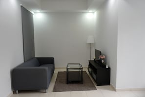 Family Apartment, 3 Bedrooms | Living room | LCD TV