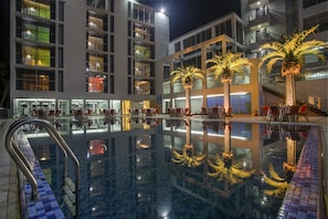 2 outdoor pools, open 8:00 AM to 8:00 PM, pool loungers - Momo Inn (Bogra)