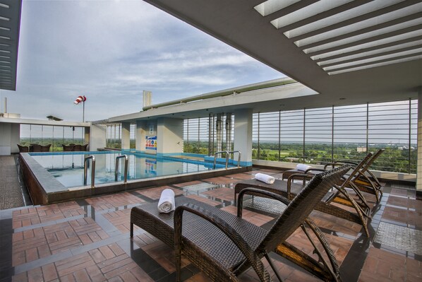 2 outdoor pools, open 8:00 AM to 8:00 PM, pool loungers