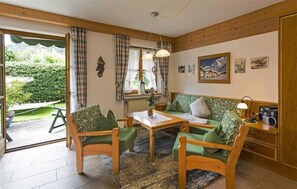 Een 100-cm flatscreentelevisie met kabelzenders en een televisie