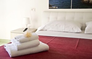 Quarto casal ou duplo (sabbia) | Frigobar, cofres nos quartos, Wi-Fi de cortesia, roupa de cama