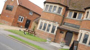 Step into the charming entrance of The Carrington Arms, where a welcoming atmosphere awaits.