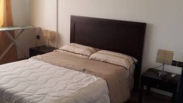 Apartment, 1 Bedroom | 1 bedroom, blackout drapes, iron/ironing board, free WiFi