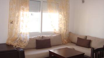 Apartment, 1 Bedroom | Living area | Plasma TV