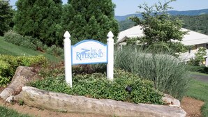 A sign for 'Inn at Riverbend' with a natural landscape in the background. - Inn at Riverbend (Pearisburg)