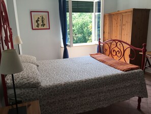 Quadruple Room, Private Bathroom | Desk, bed sheets