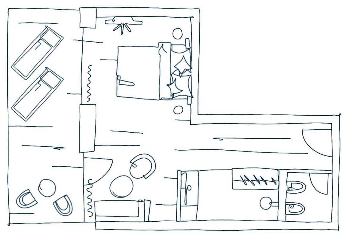 A simple floor plan with two bedrooms, a bathroom, a kitchen, and a living area.