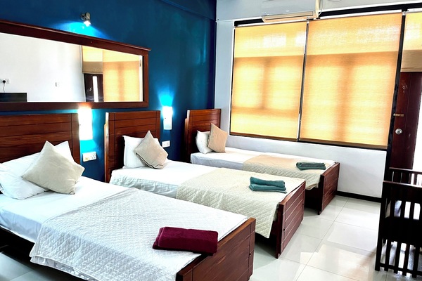 Deluxe Triple Room | Desk, blackout drapes, iron/ironing board, WiFi (free)