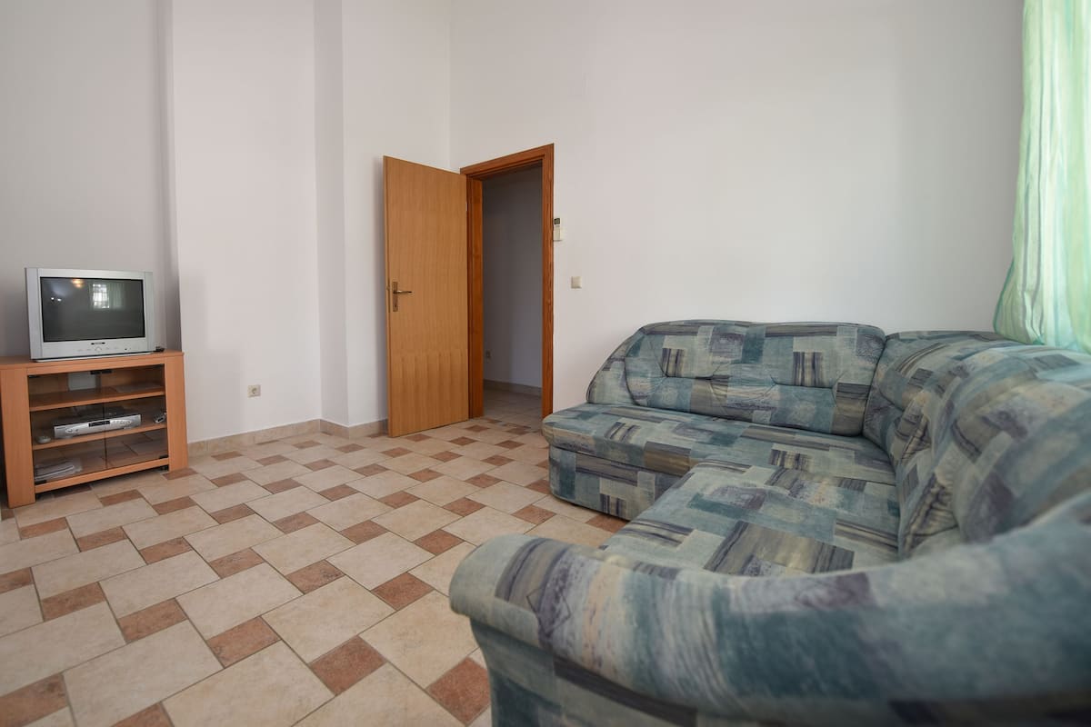 Apartment, 1 Bedroom | Living room | TV