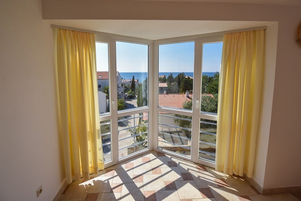 Apartment, Sea View | Living area | TV