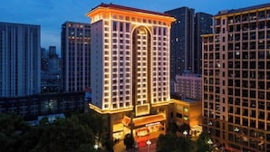 A high-rise hotel with a prominent entrance and multiple floors.