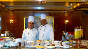 A buffet setup with various dishes and a coffee machine. - MS Nephtis Nile Cruise (Luxor)