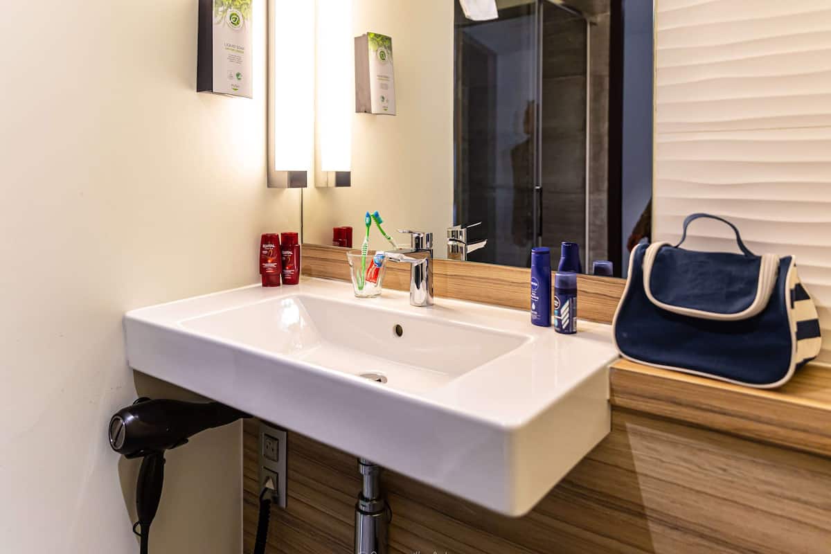 next generation, room, multiple beds | bathroom | eco-friendly toiletries, hair dryer, towels