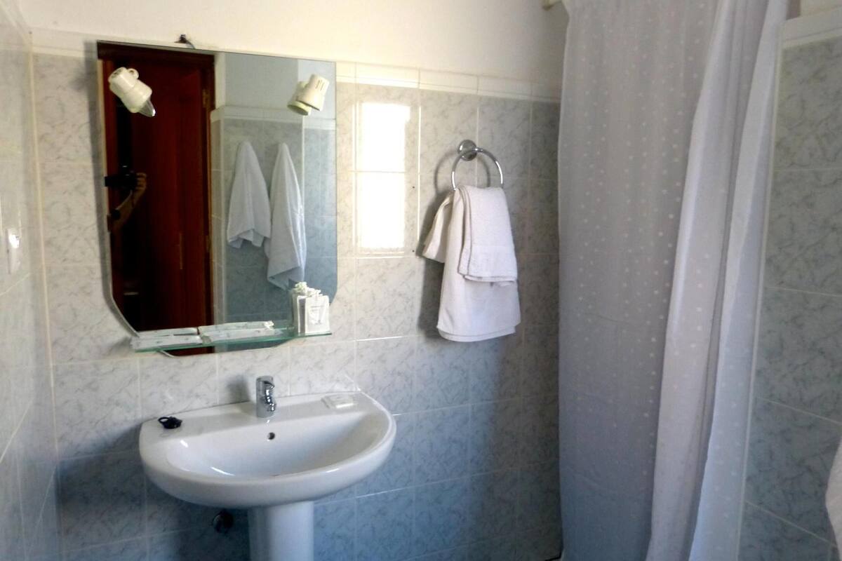 deep-soaking bathtub, rainfall showerhead, free toiletries, hair dryer
