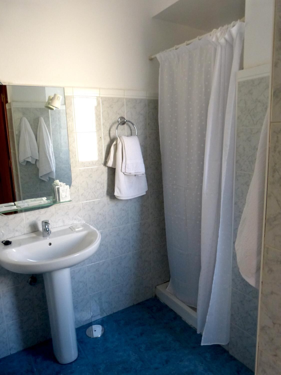 deep-soaking bathtub, rainfall showerhead, free toiletries, hair dryer