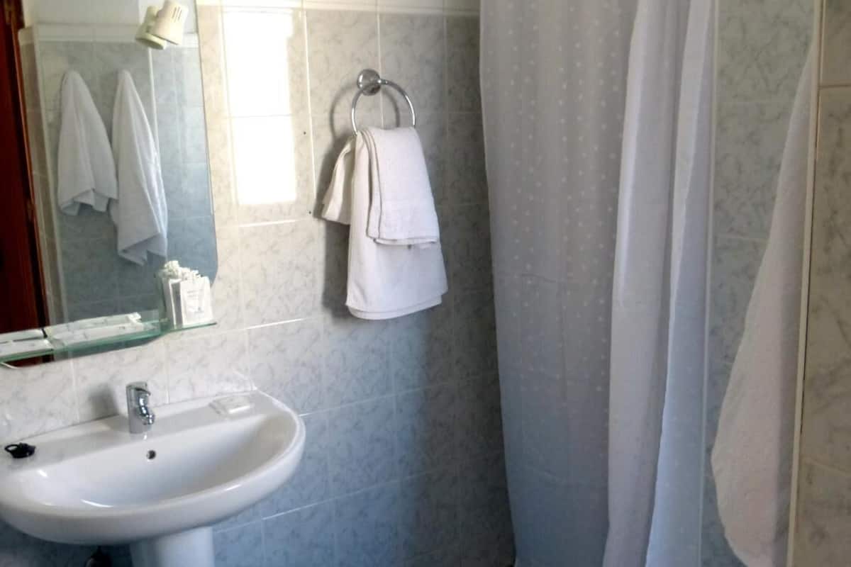deep-soaking bathtub, rainfall showerhead, free toiletries, hair dryer