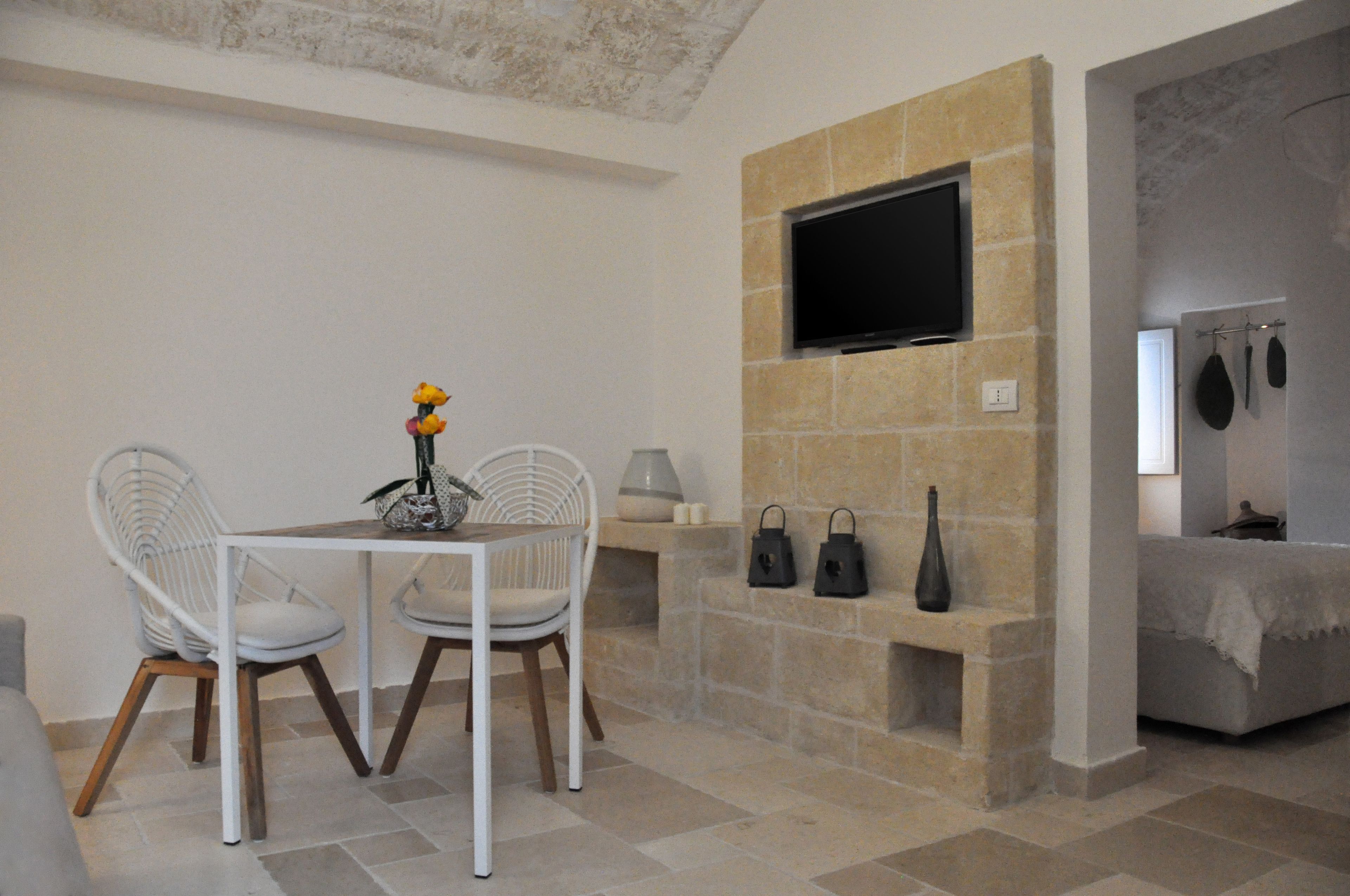 Suíte superluxo, vista para o pátio (Poseidonia) | 1 quarto, lençóis italianos Frette, roupas de cama premium
