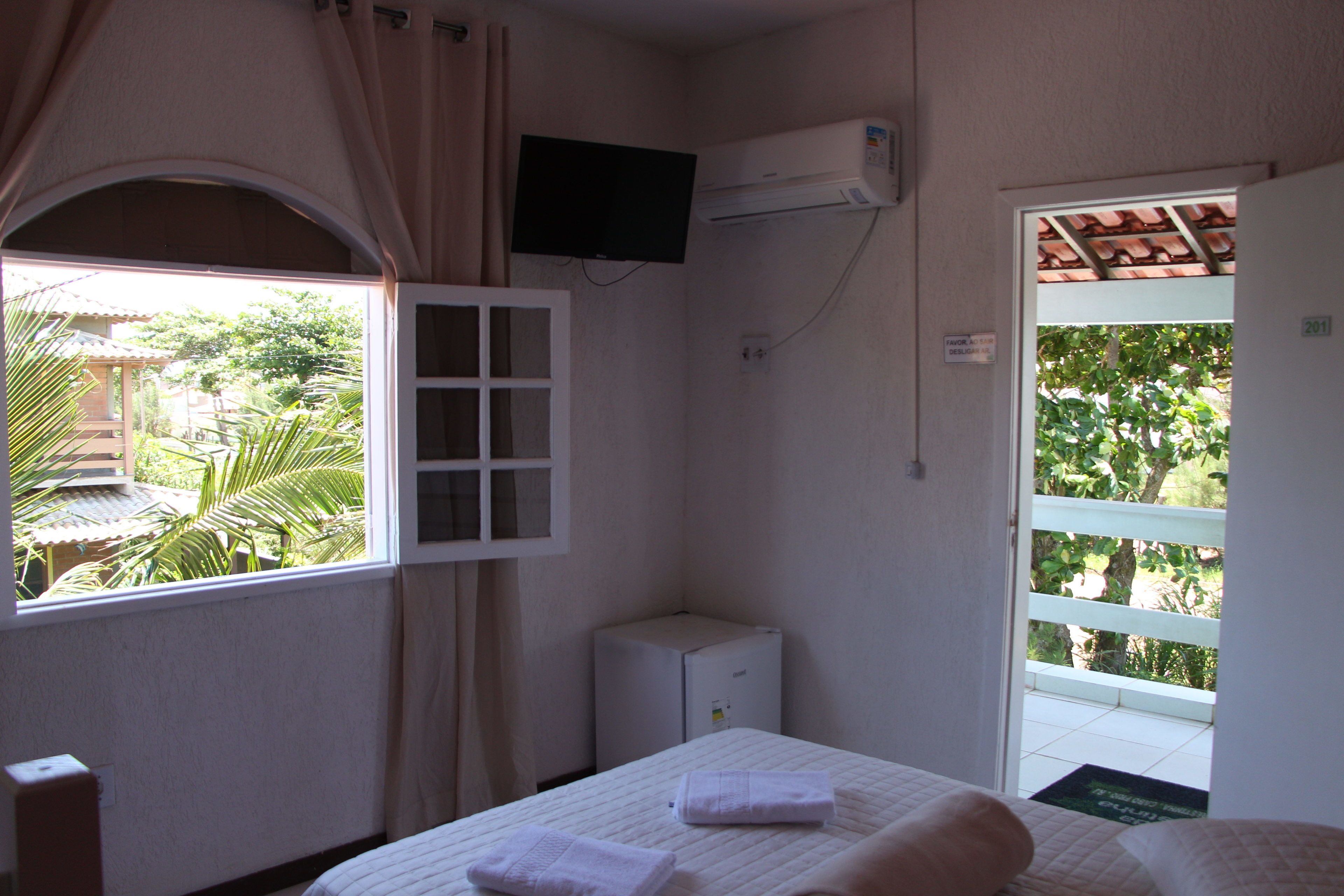 Quarto casal standard | Frigobar, cortinas blackout, ferros/tábuas de passar roupa