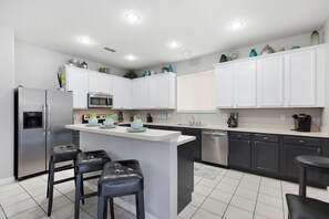 Fridge, microwave, oven, stovetop - Magical Family Villa: 8-Bdrm, 5 Themed, Pool, Spa, Game Room, Arcade, Movie (Davenport)