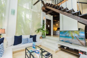 TV, DVD player - 2 Bedroom condo with a 2 level high Living Room by BRIC at the Royal Palms (Playa del Carmen)
