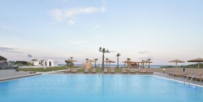 Outdoor pool, open 9:00 AM to 6:30 PM, pool umbrellas, pool loungers