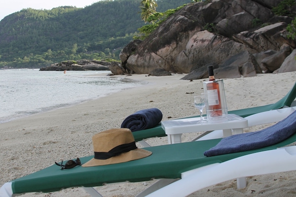 Enjoy 1 of one of Seychelles' best beaches with one of our 8 sun loungers