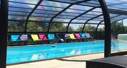 A 2 bedroom gite sleeping 4 plus a cot with access to a heated covered pool.