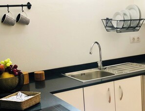 Fridge, microwave, stovetop, coffee/tea maker
