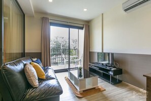 1 Bedroom Condo with Garden View | Living room | Smart TV - Condo Rain Chaam-Huahin by Joy (Cha-am)