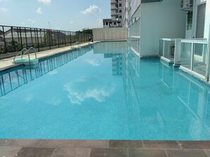 Outdoor pool, pool umbrellas, pool loungers