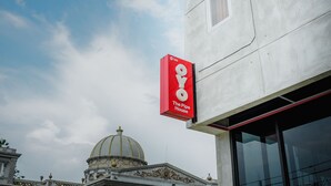 A building with a large dome and a red sign for 'The Pipe House'. - OYO 183 The Pipe House (Palembang)