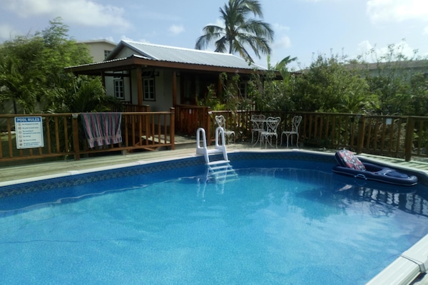 A view of the Pool House from the other side of the pool.