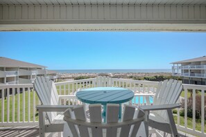 Outdoor dining - SSV 207: Oceanfront Condo with Pool and Views! (Oak Island)
