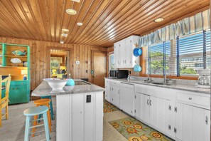 Fridge, microwave, oven, stovetop - Sea And Sound: Beachy Oceanfront Home on West Beach, Oak Island. (Oak Island)