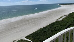A beach with a clear sky, a sandy shore, and a view of the ocean. - Direct Gulf Of America Views! (Marco Island)