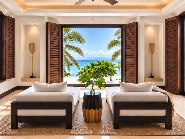 A room with two beds, a large window with a beach view, and a ceiling fan.