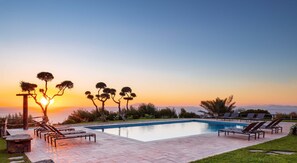 Seasonal outdoor pool, pool loungers