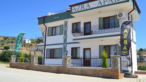 A two-story building with balconies and a sign reading "AZRA APART". - Azra Apart & Otel (Gökçeada)