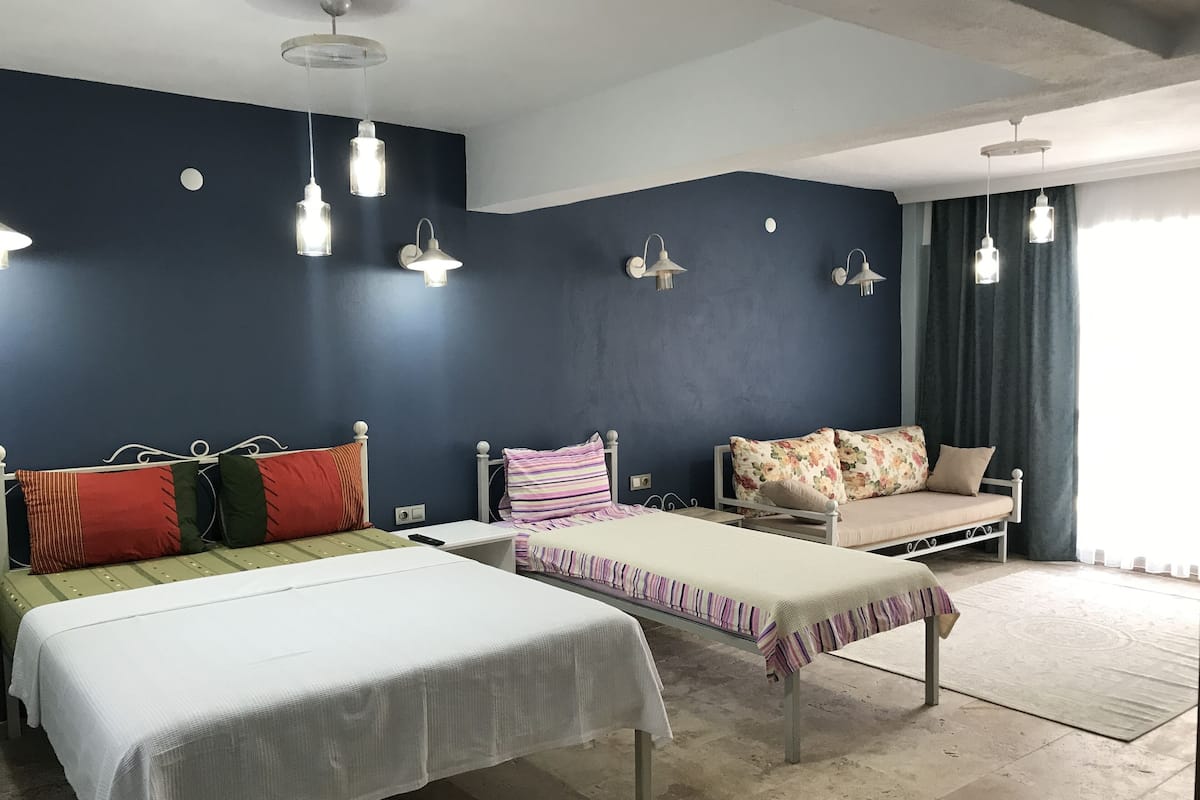 Deluxe Triple Room, Patio, Ground Floor | 1 bedroom, minibar, desk, soundproofing