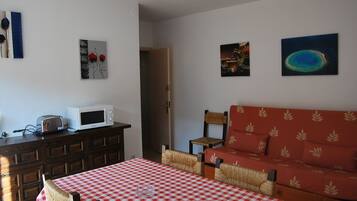 Apartment, 1 Bedroom | Living area | Flat-screen TV