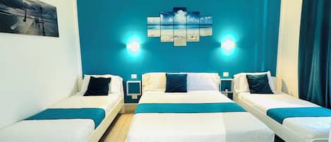 Triple Room, City View | Minibar, desk, blackout drapes, soundproofing