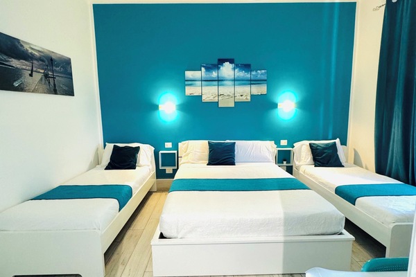 Triple Room, City View | Minibar, desk, blackout drapes, soundproofing
