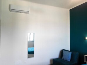 Quarto triplo, vista para a cidade | Comodidades do quarto