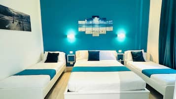 Triple Room, City View | Minibar, desk, blackout drapes, soundproofing