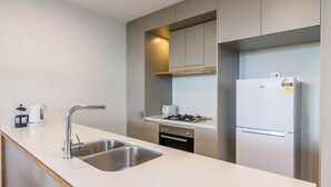 Studio | Private kitchen | Full-sized fridge, microwave, oven, stovetop - Light, Modern Studio- Central to City and Airport (Nundah)