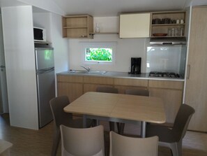 Family Mobile Home, 3 Bedrooms | Private kitchen | Full-sized fridge, microwave, stovetop, coffee/tea maker - Camping Les Sables (Tournon-sur-Rhone)