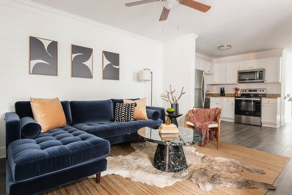 Welcome to your downtown Charleston rental! Plenty of seating space for your group between both living room spaces :)