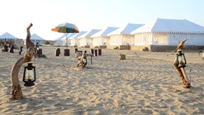 A desert scene with tents and camels. - The Chirag Desert Camp Sam Sand Dunes (Jaisalmer)
